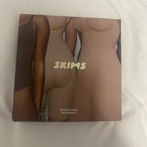 Brand New, Never worn SKIMS black bodysuit.